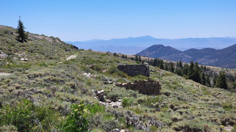 Stone ruin walls on a high ridge near Treasure City with sweeping White Pine Range views