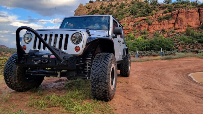 Jeep JKU on Nitto Trail Grappler tires and ATX Wheels Slab beadlocks on a red rock desert trail